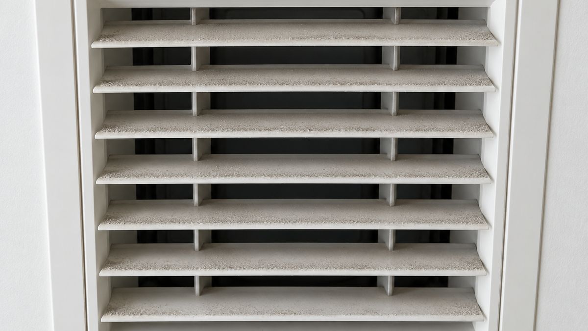 Illustrative dusty ceiling AC grille in a Dubai apartment
